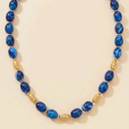 Collier Calista en perles ovales de résine bleue avec séparateurs dorés